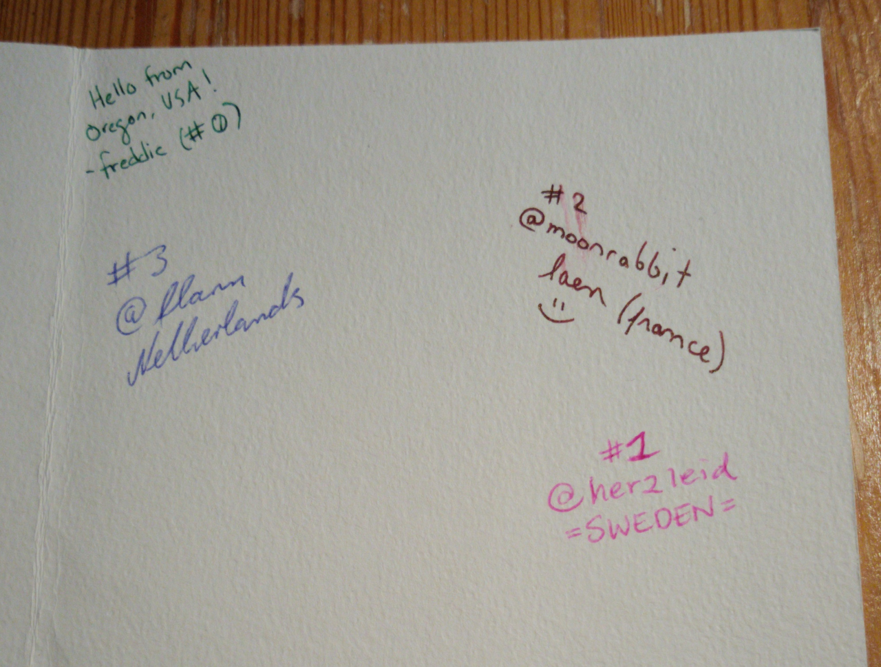 the inside of the card with several signatures: freddie, herzleid, laen, and flann